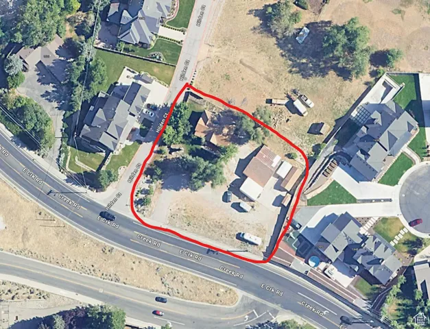 Aerial map of property and surrounding area featuring property boundaries highlighted