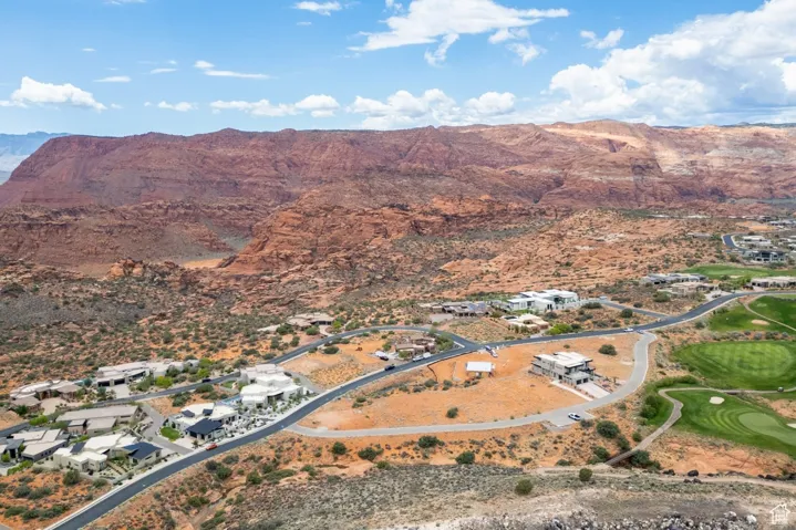 Aerial view of property's location with a mountainous background