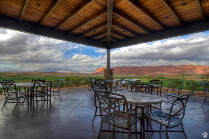 View of patio / terrace with a mountain view and outdoor dining area