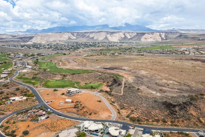 Aerial overview of property's location featuring a mountainous background