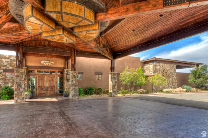 View of exterior entry with stone siding