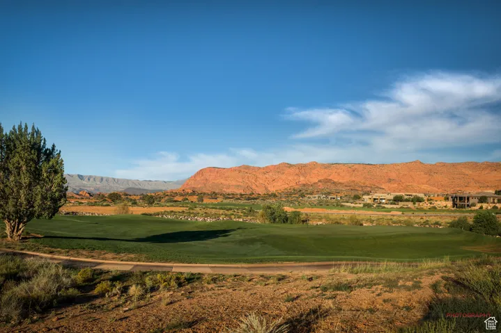 View of mountain background featuring a local golf course and a nearby body of water