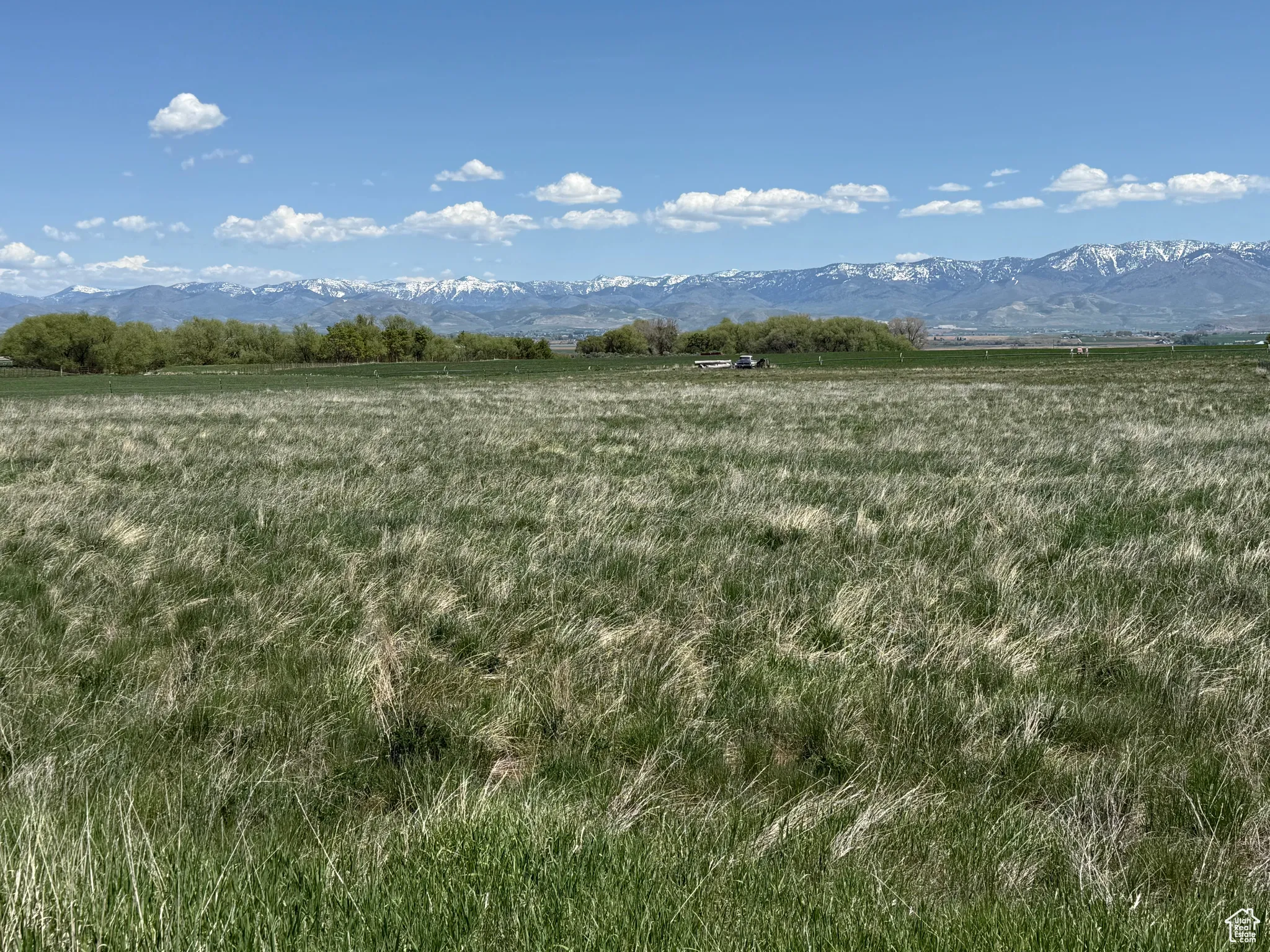 View of undeveloped land with a mountain backdrop and rural landscape