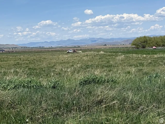 View of mountain backdrop featuring rural landscape