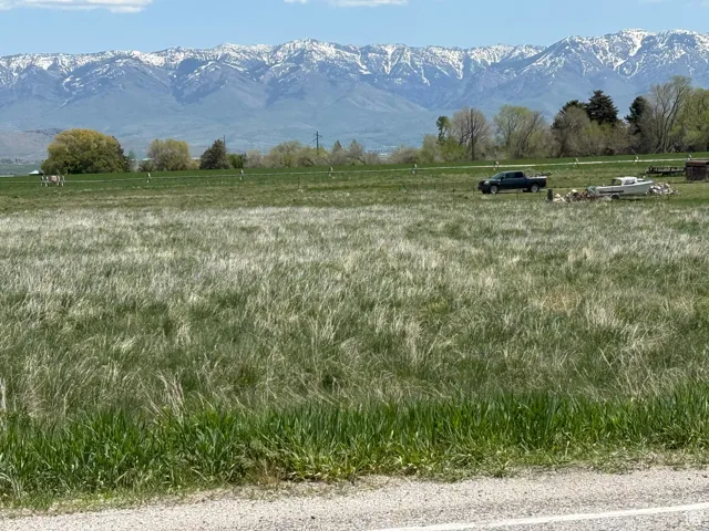 View of mountain backdrop with rural landscape
