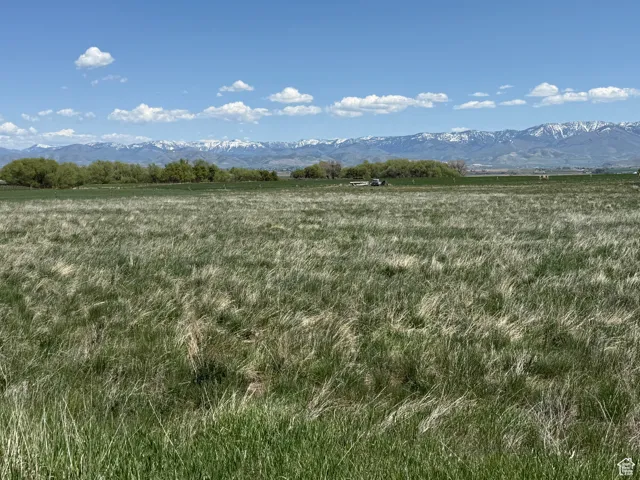 View of undeveloped land with a mountain backdrop and rural landscape