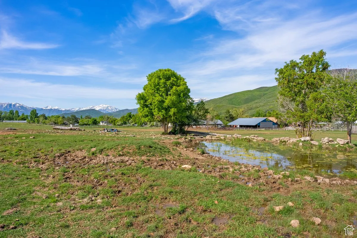 Water view with a mountain backdrop and rural landscape