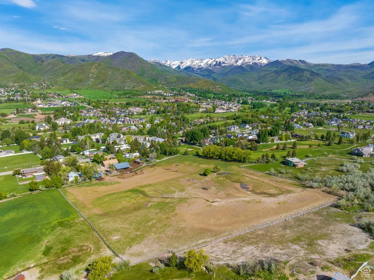 Aerial view of residential area featuring mountains