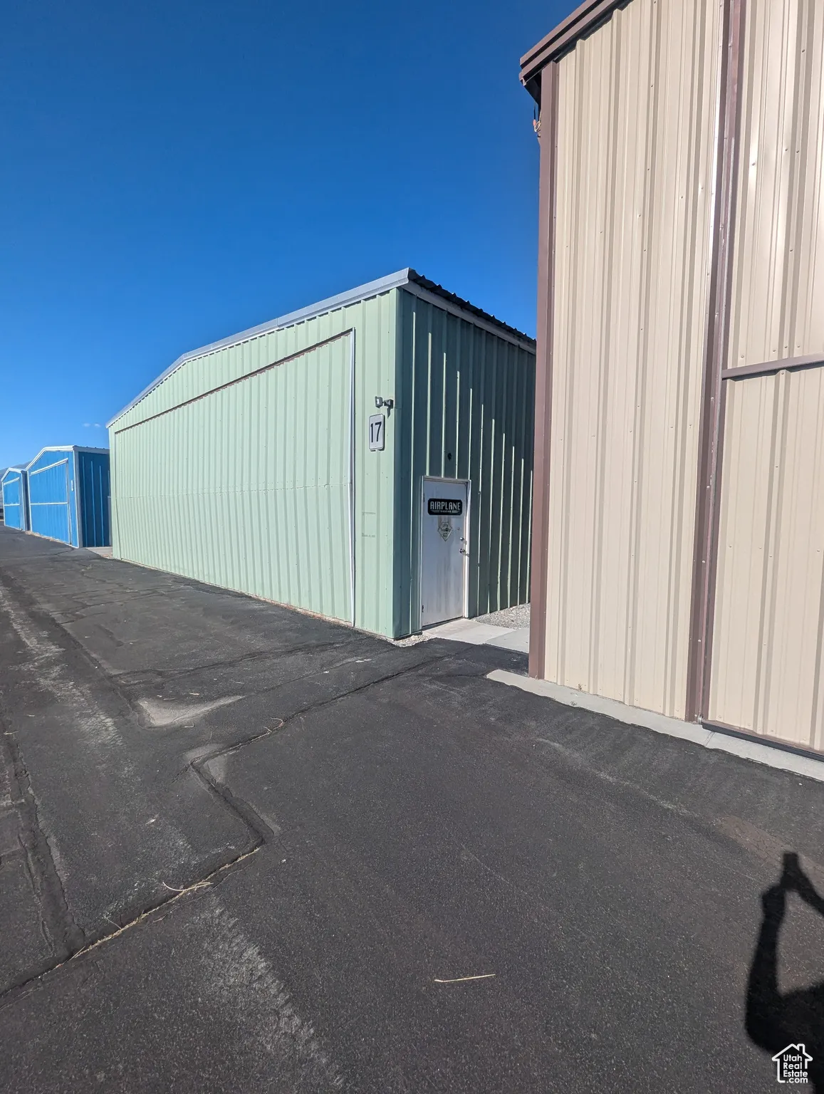 View of outdoor structure with an outbuilding