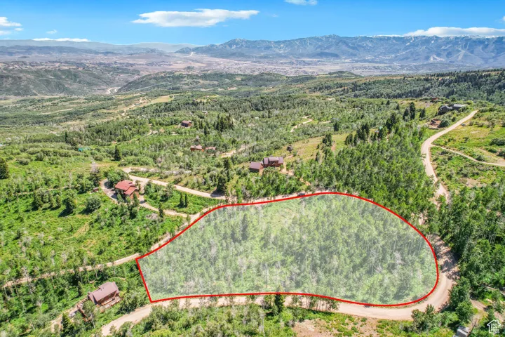 Aerial overview of property's location with property parcel outlined