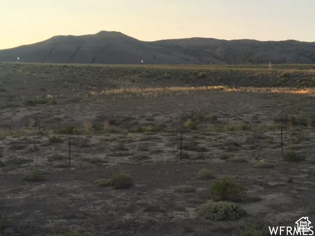 View of mountain background featuring rural landscape