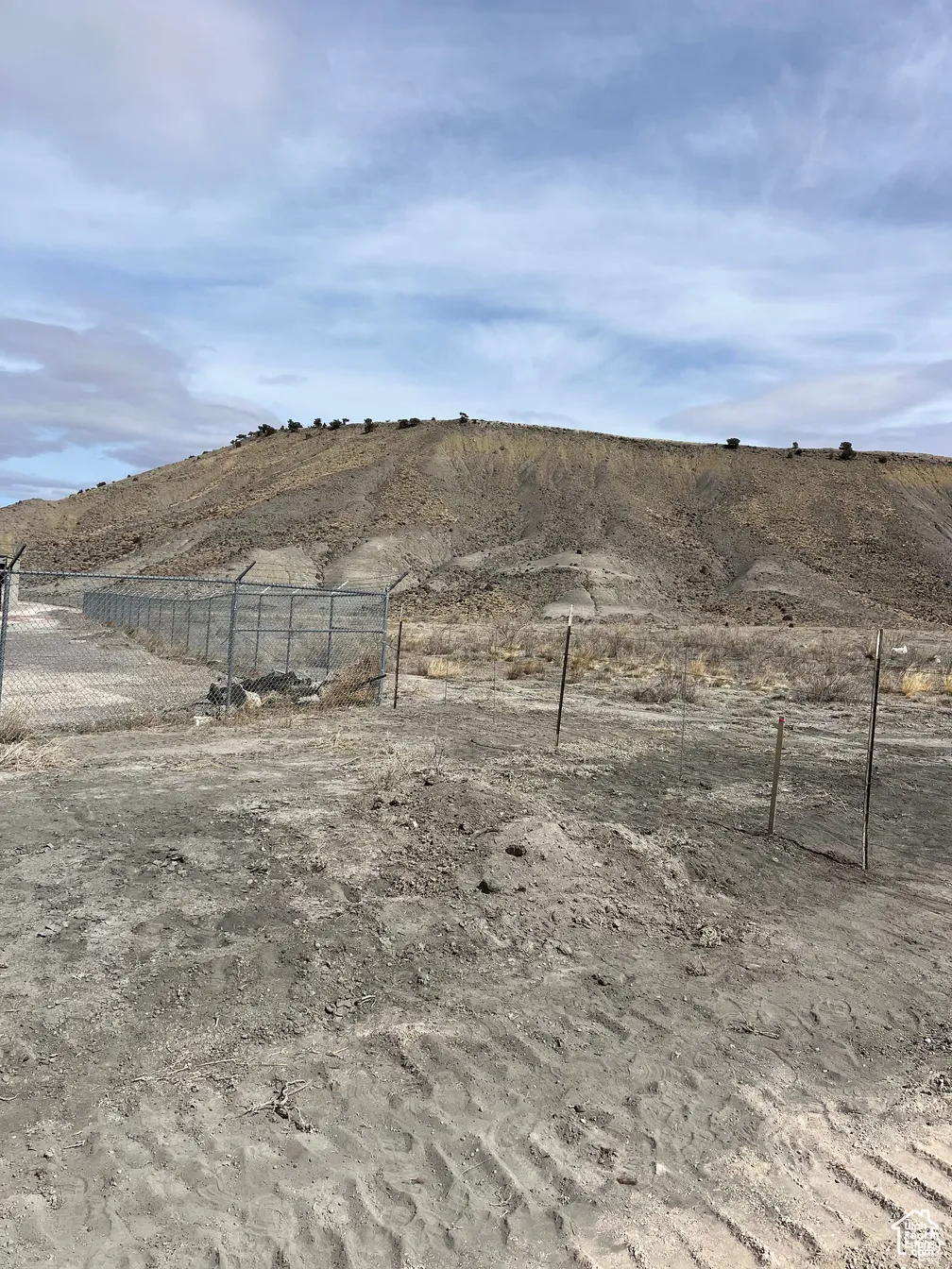 View of yard featuring fence and a view of rural / pastoral area