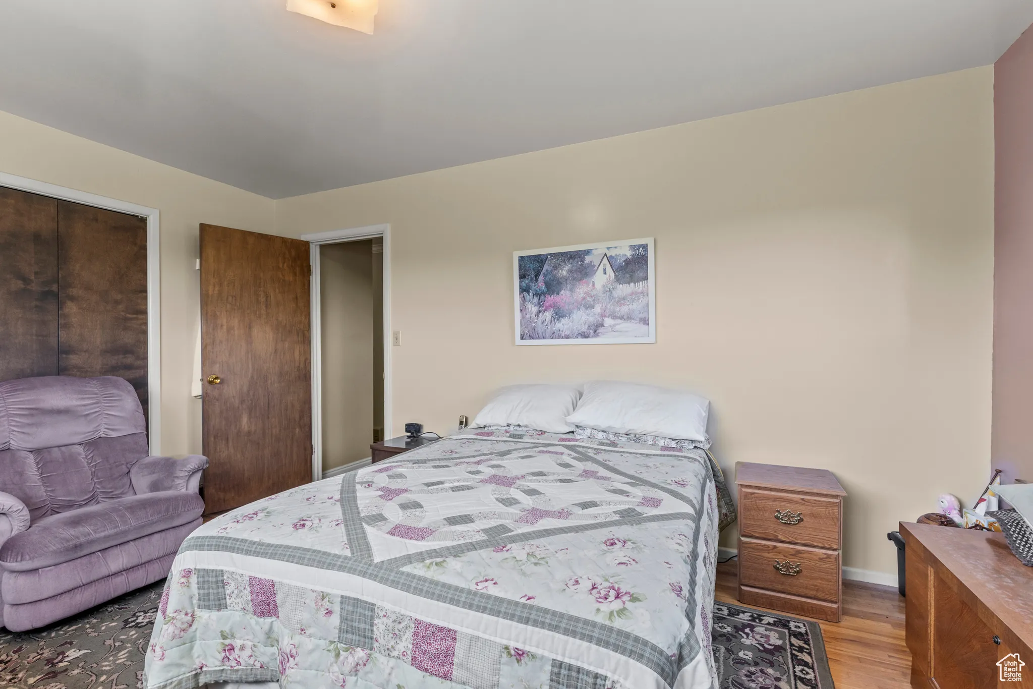 Bedroom featuring light wood-style floors and baseboards