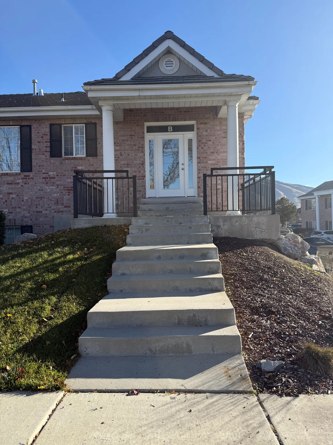 View of front of house with brick siding