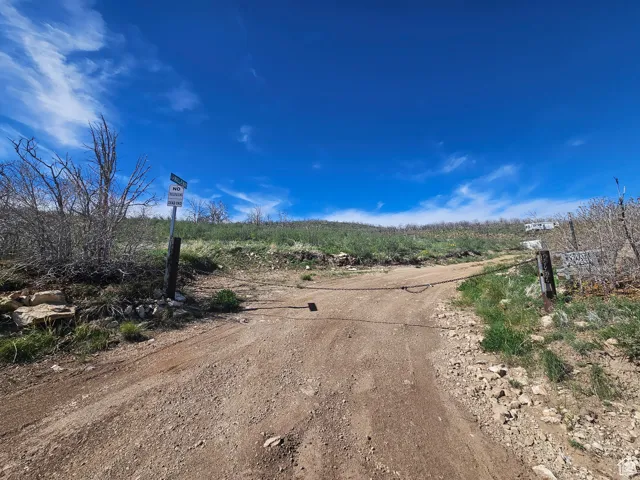 Entrance to shared/locked chained road up to the property