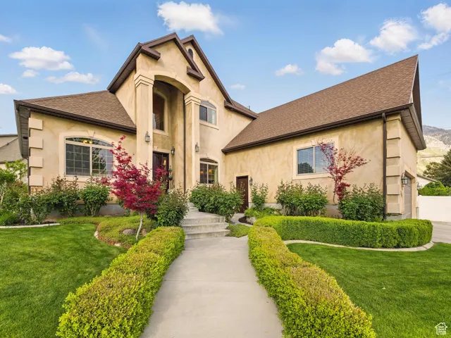 Gorgeous front landscaping with loads of roses!