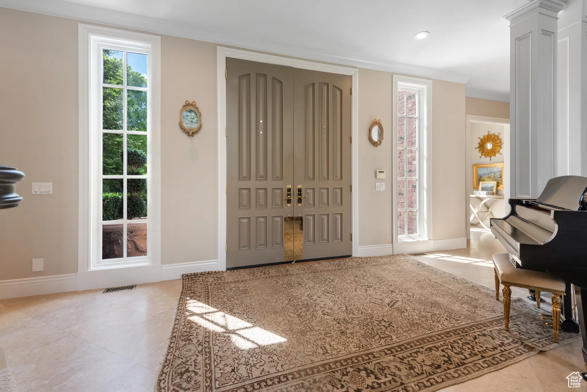Entrance foyer featuring ornamental molding, baseboards, tile patterned floors, and recessed lighting