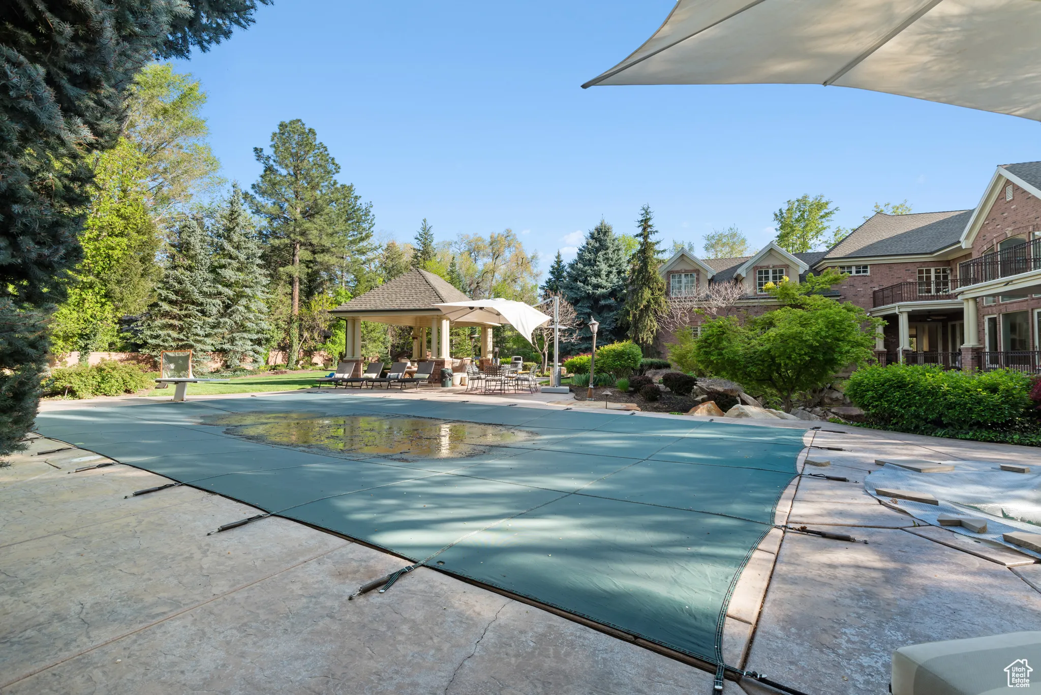 View of swimming pool with a patio area and a covered pool