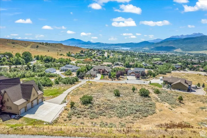 Aerial view of residential area featuring a mountain backdrop