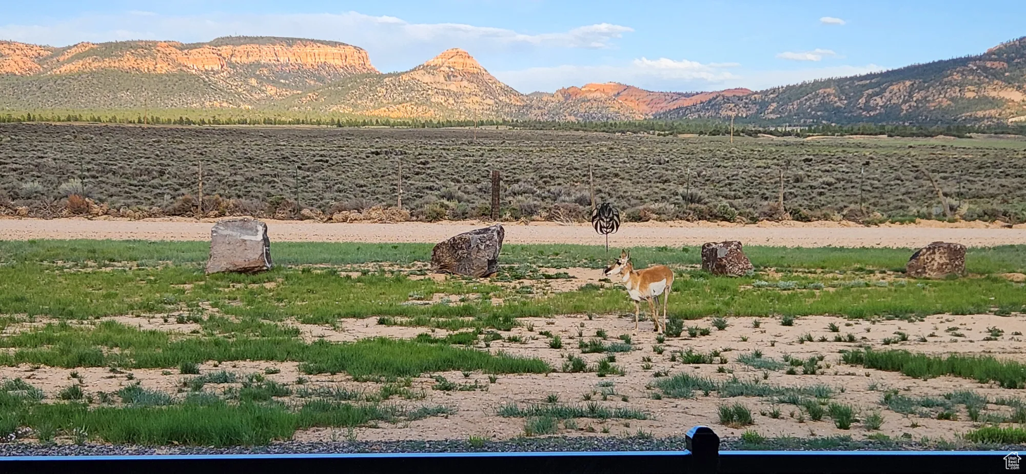 View of mountain background featuring rural landscape