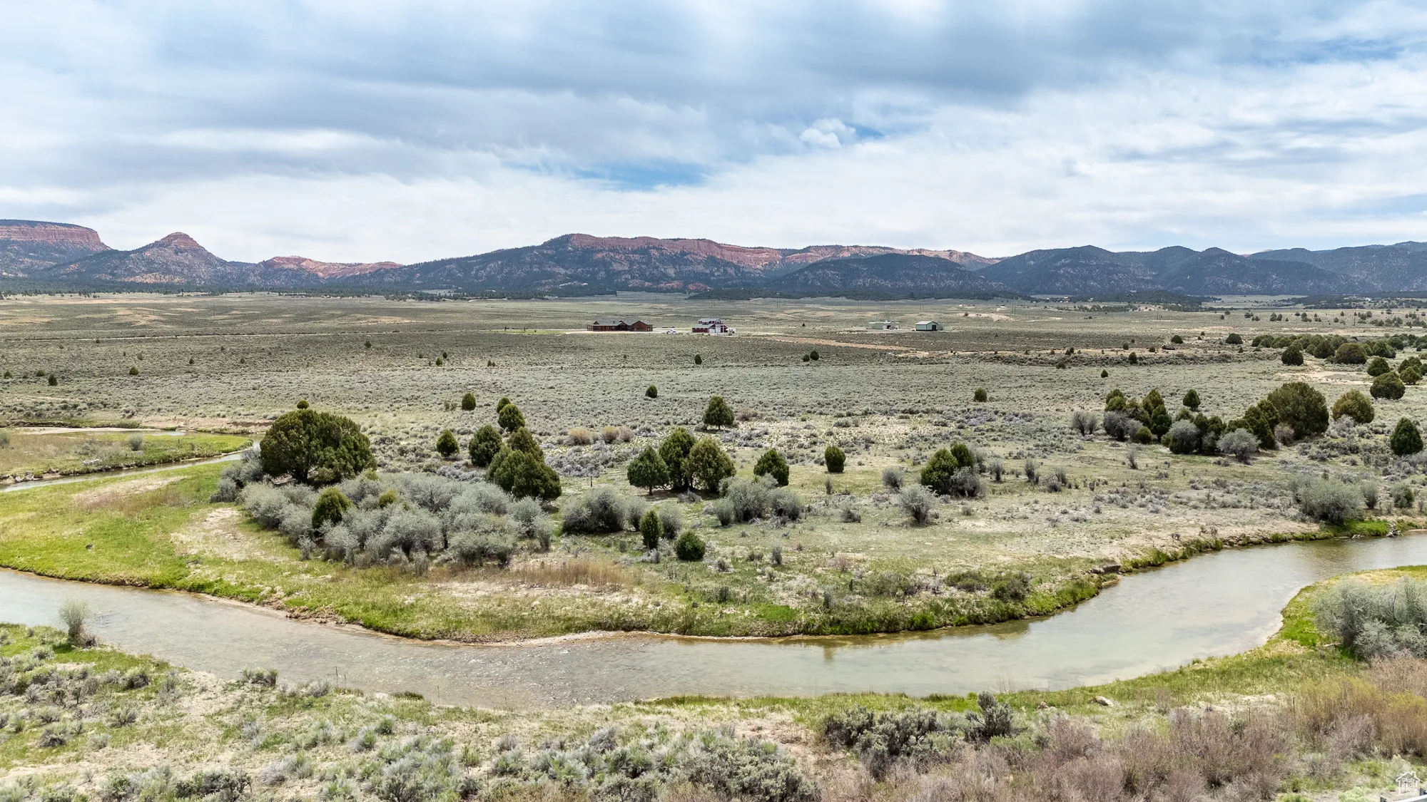 Mountain view with rural landscape and a large body of water