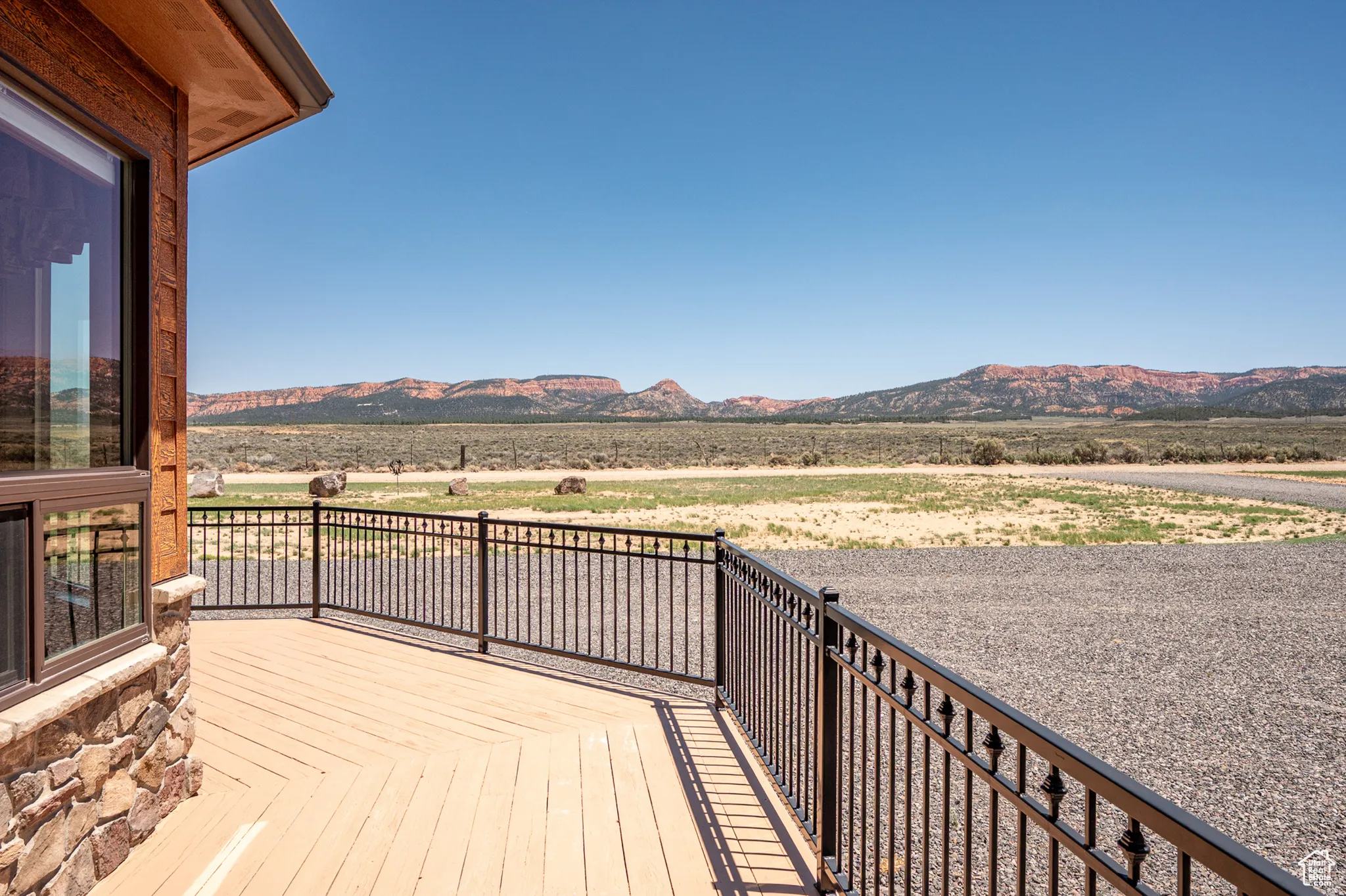 Deck with a mountain view and a view of rural / pastoral area