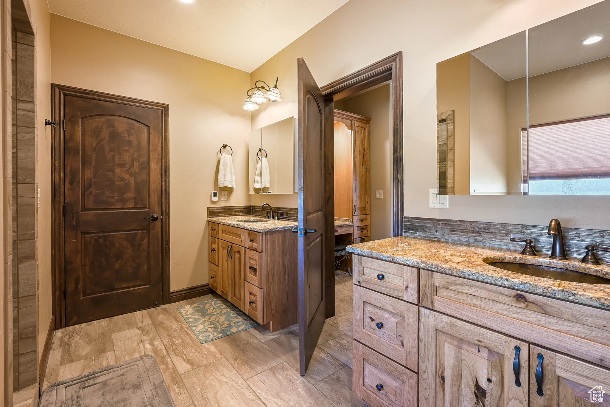 Master Bathroom featuring two vanities and recessed lighting
