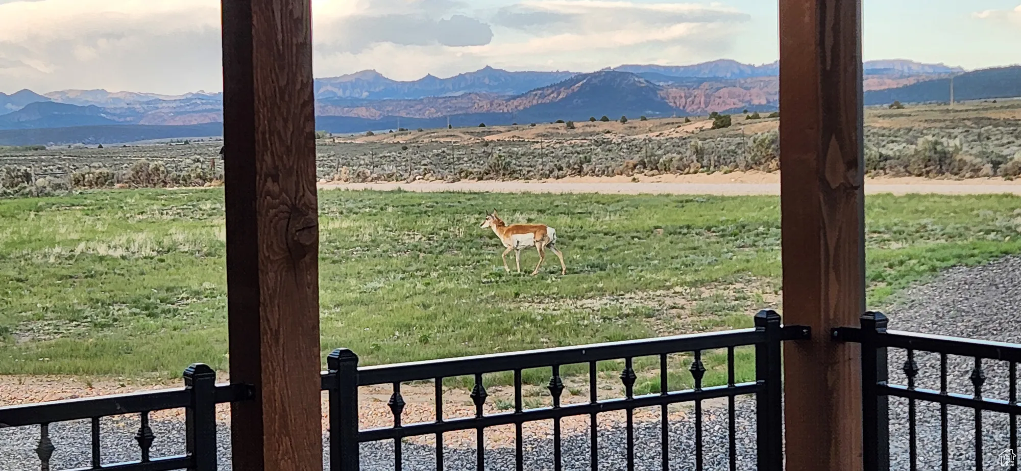 View of mountain backdrop with rural landscape