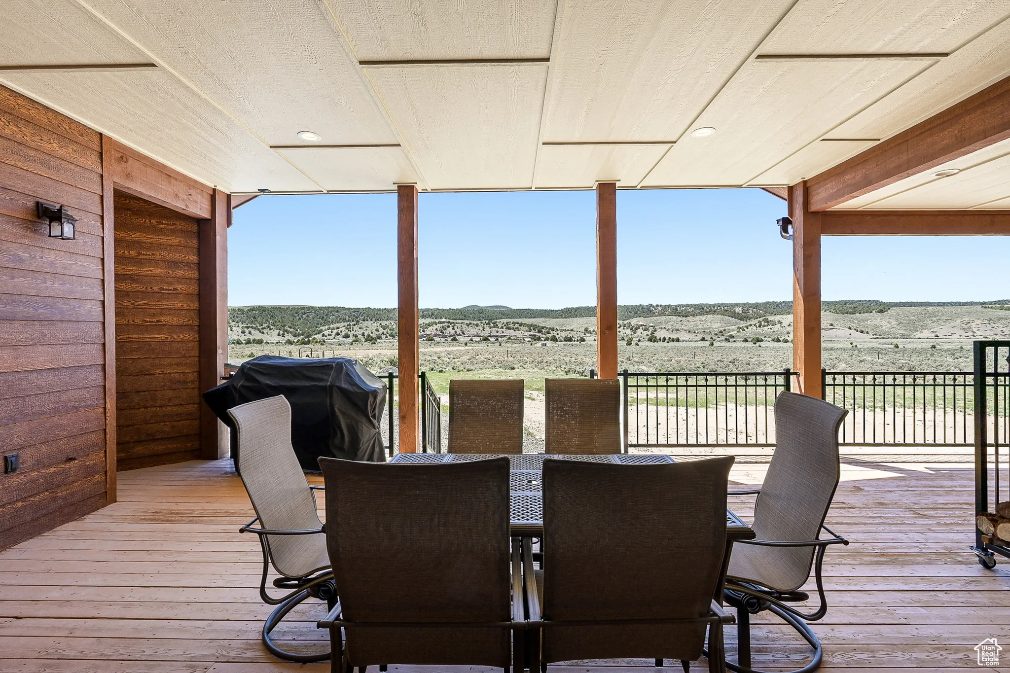 Back deck with grilling area and a mountain view