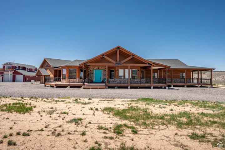 View of front of property with home and barn