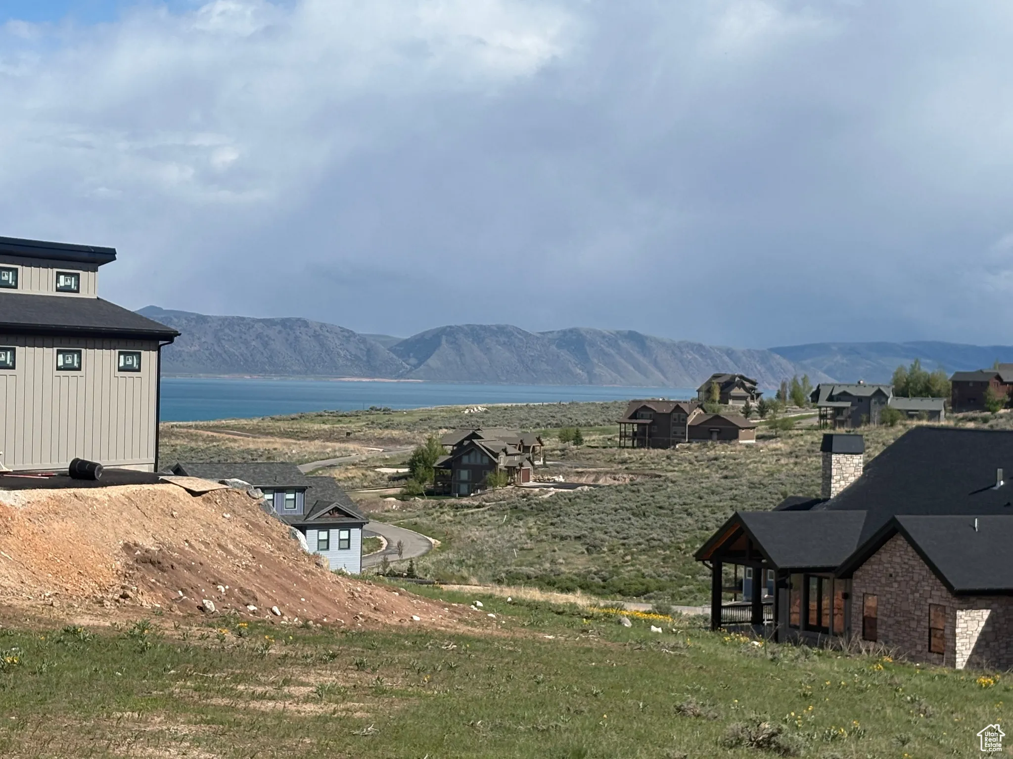 View of mountain backdrop featuring a nearby body of water