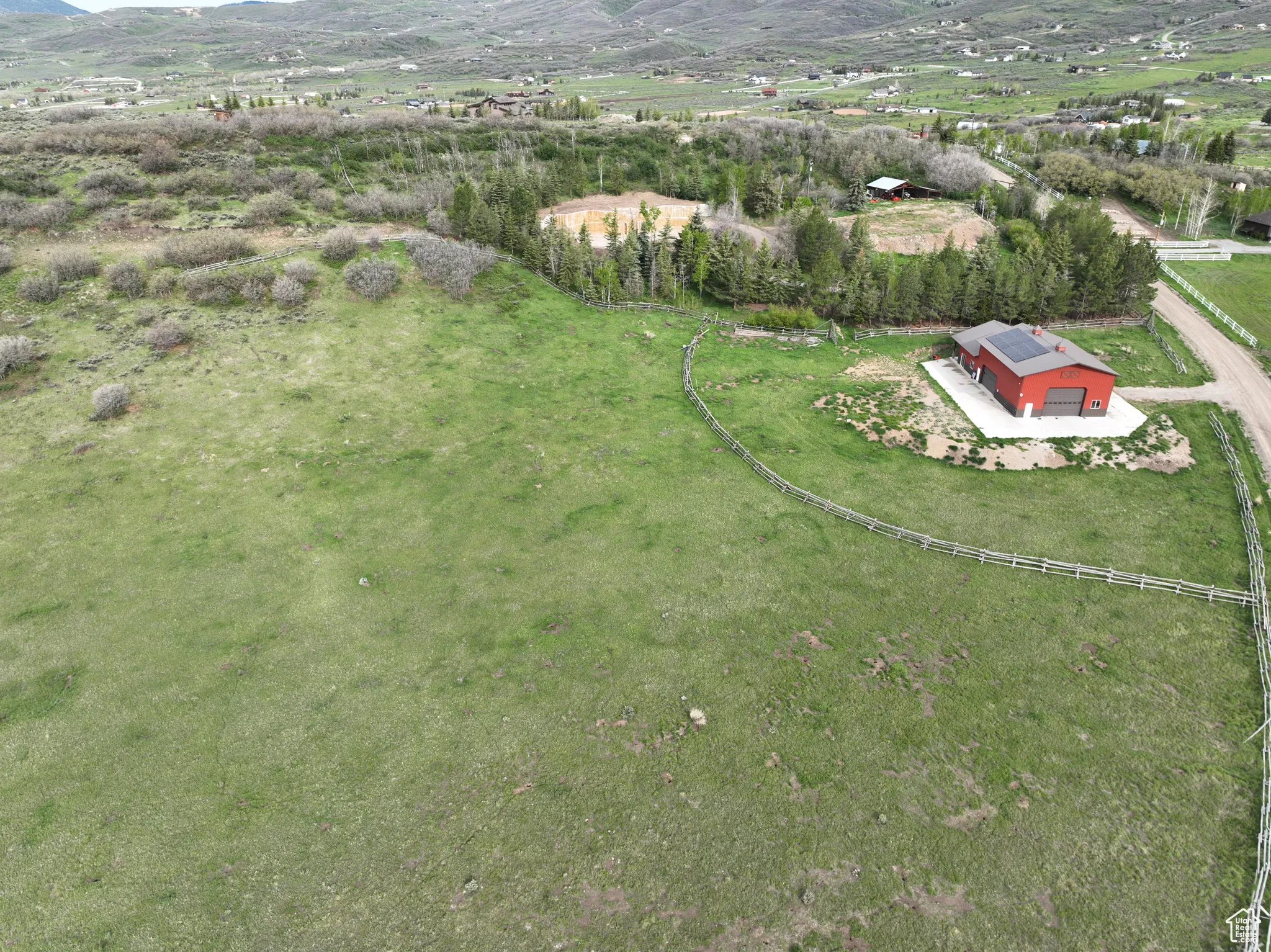 Aerial view of property's location featuring a mountain backdrop and rural landscape;12.48 Acres 8819 Highfield Road Park City, Utah 84098. Utilities at building site
