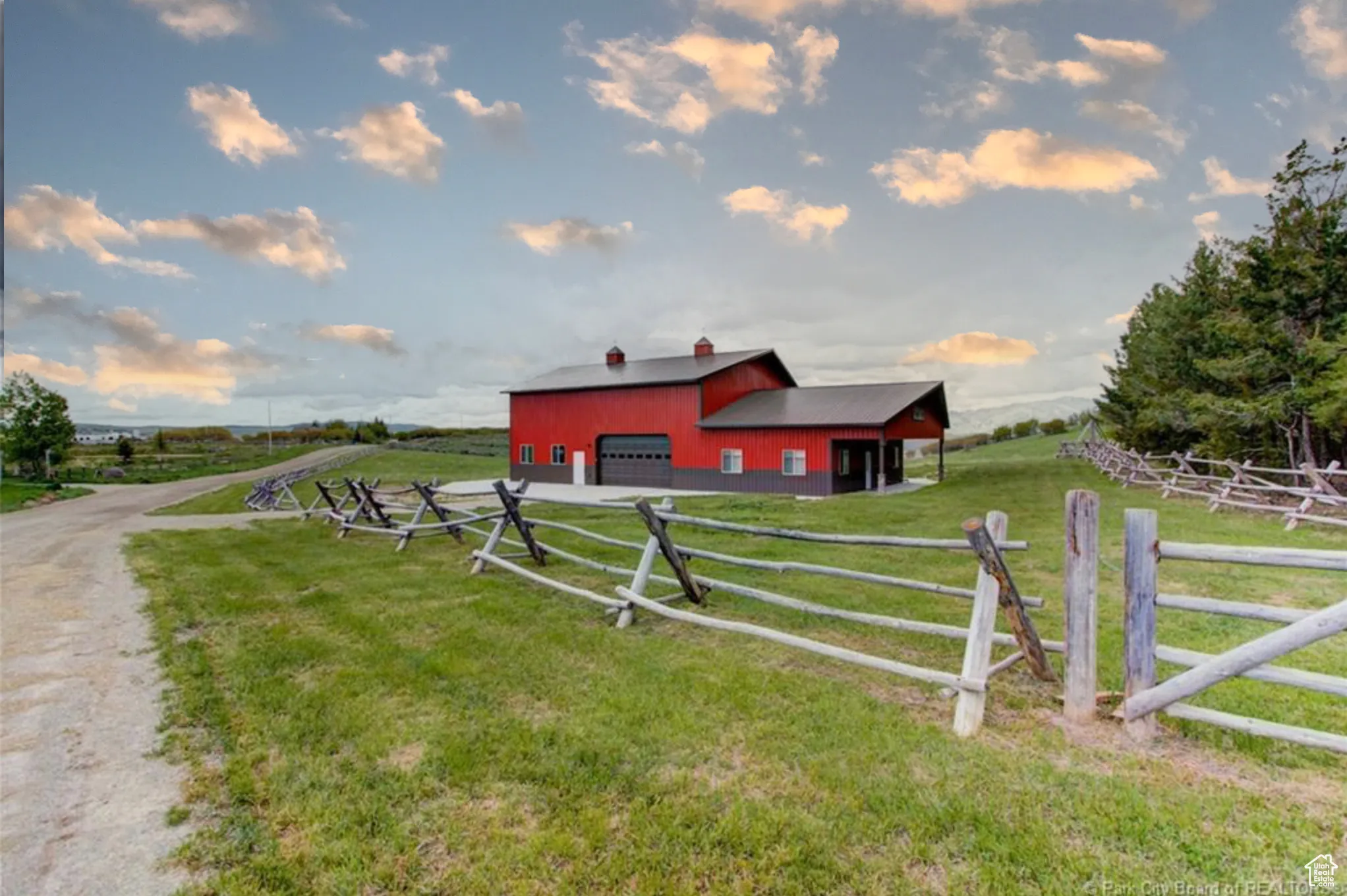 View of yard with a pole building, an outdoor structure, and a rural view