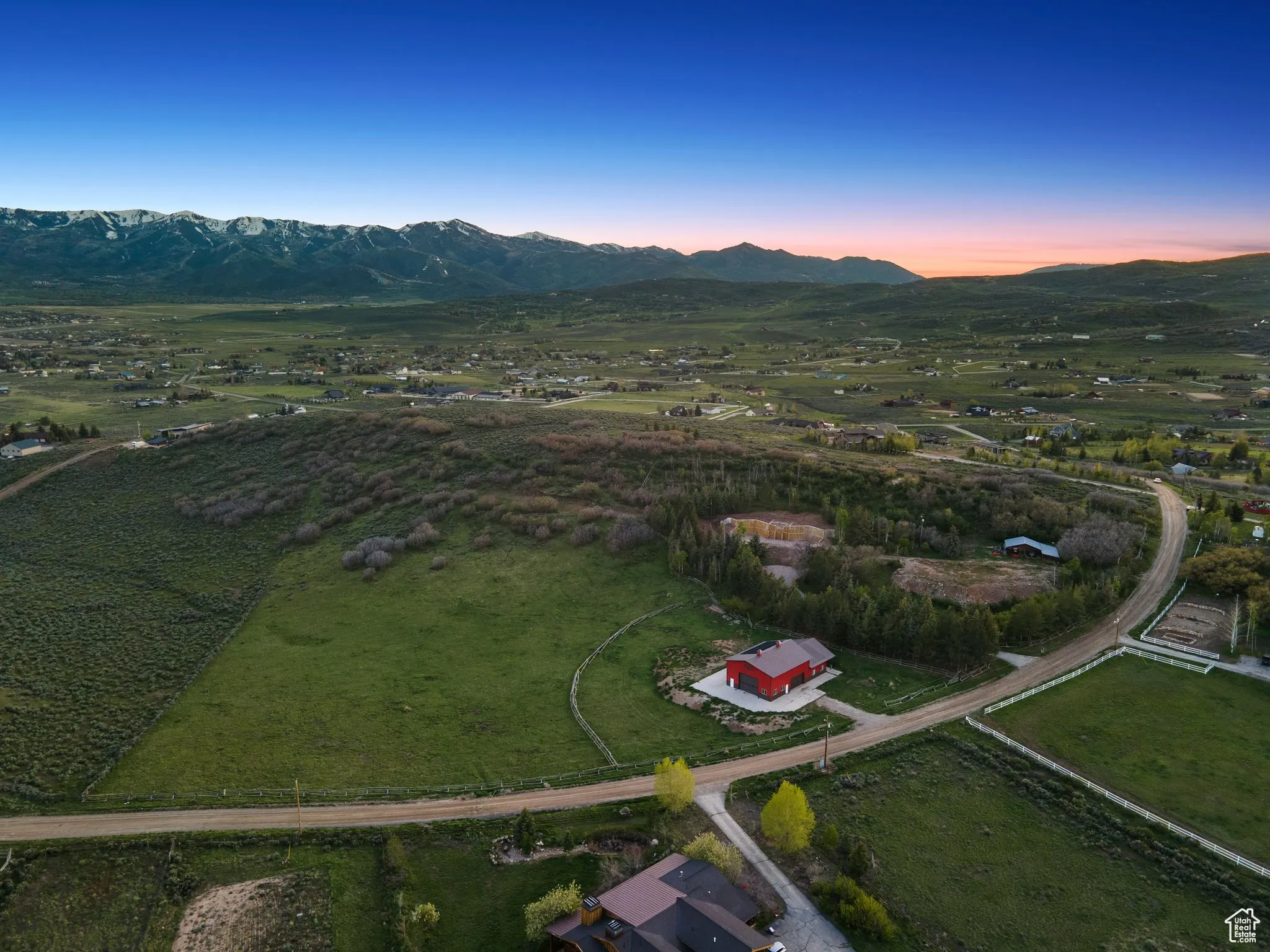 Aerial view at dusk of a mountain view and a view of countryside