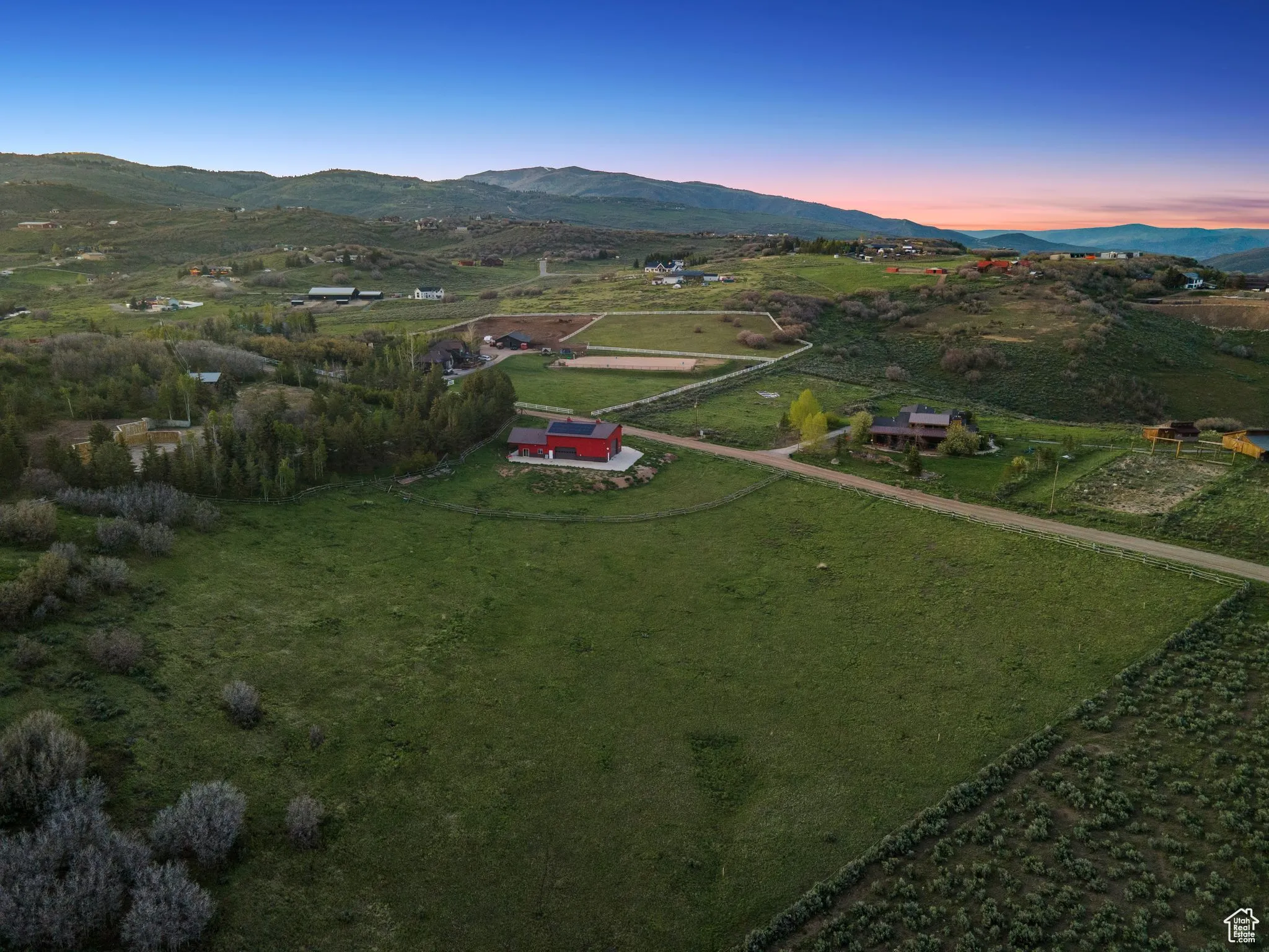 Aerial view at dusk of a mountain view and a rural view