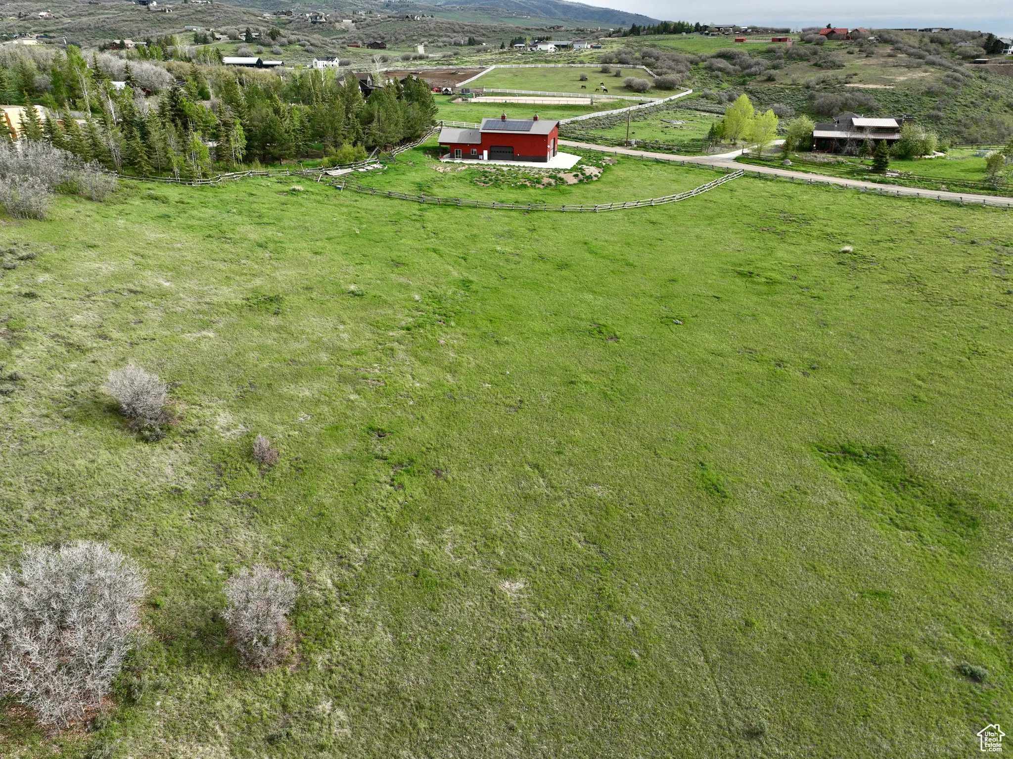 Aerial view of property's location with rural landscape; 12.48 Acres 8819 Highfield Road Park City, Utah 84098. Utilities at building site