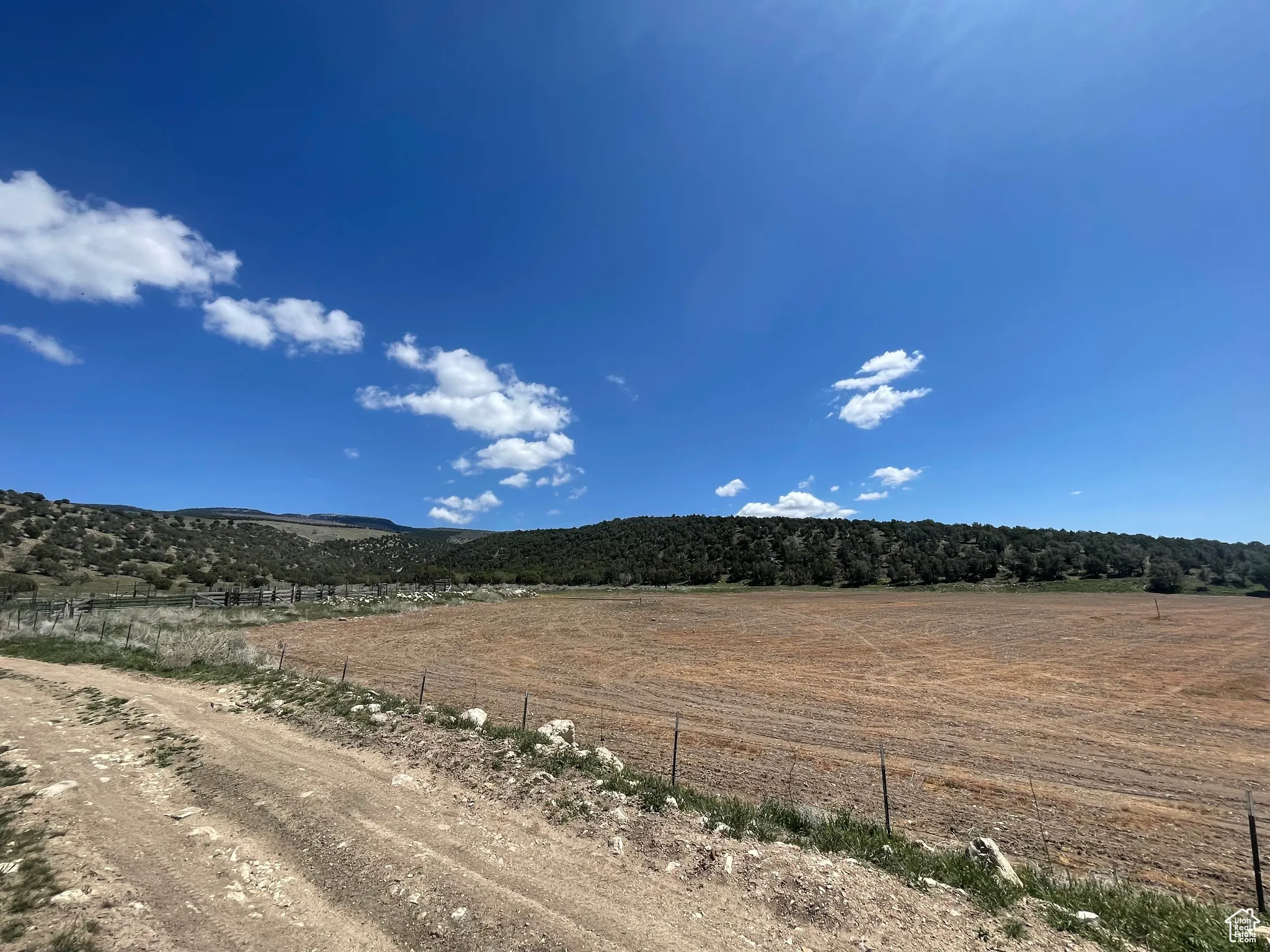 View of mountain backdrop with rural landscape