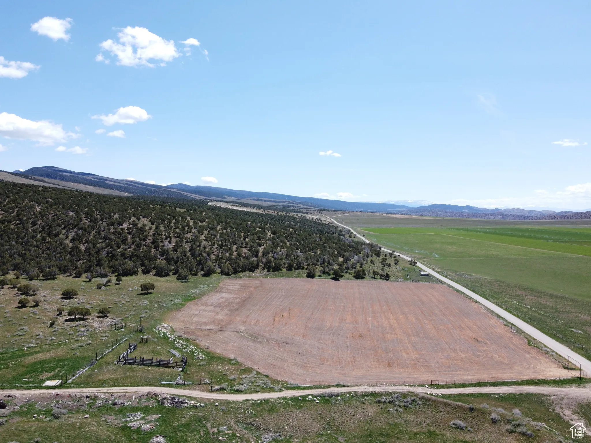 View of mountain backdrop featuring rural landscape