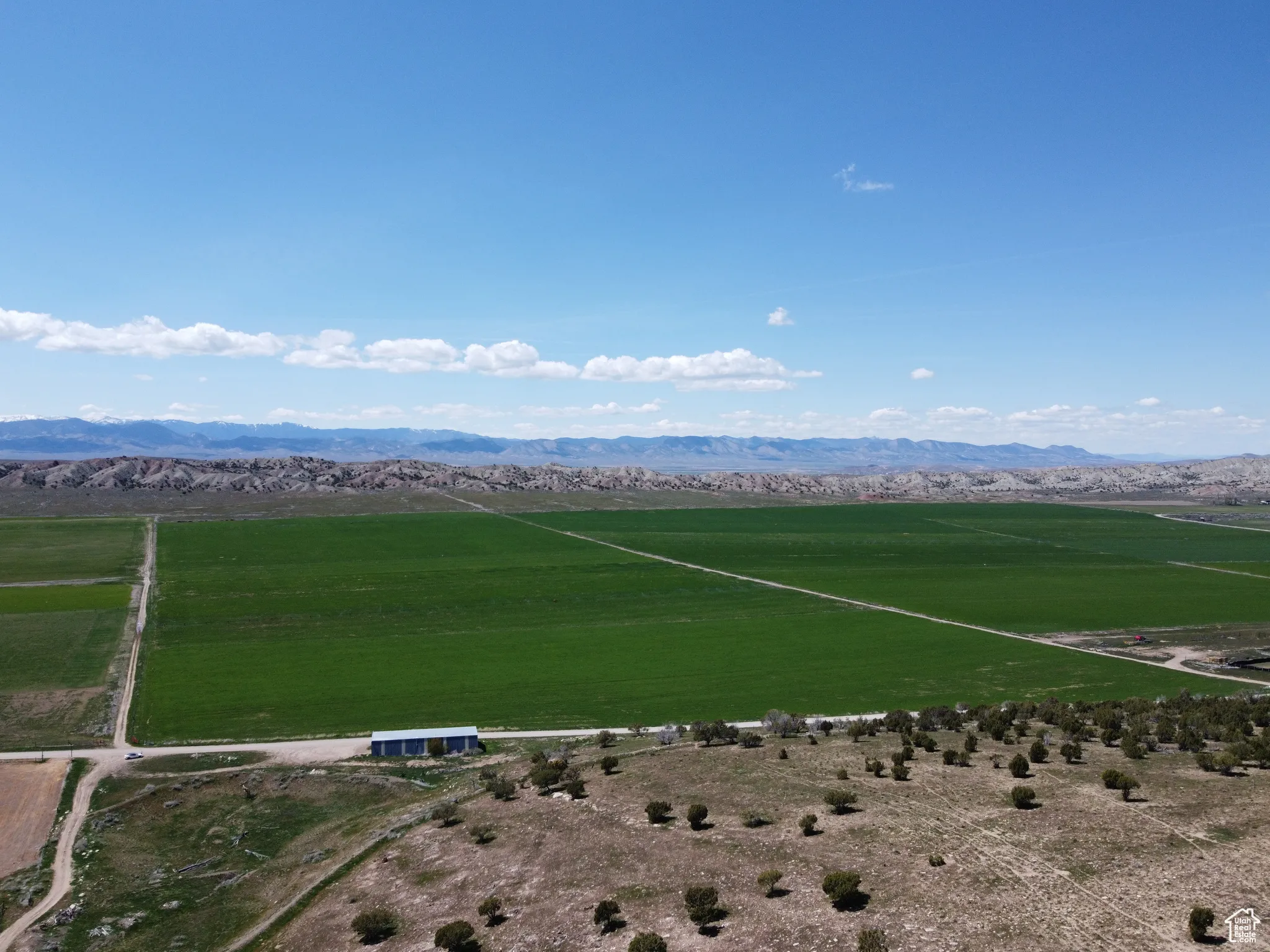 Aerial view of sparsely populated area with a mountainous background