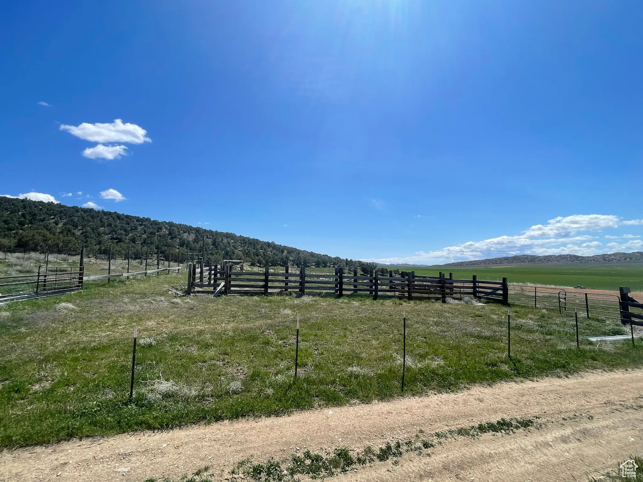 View of yard with a rural view and fence