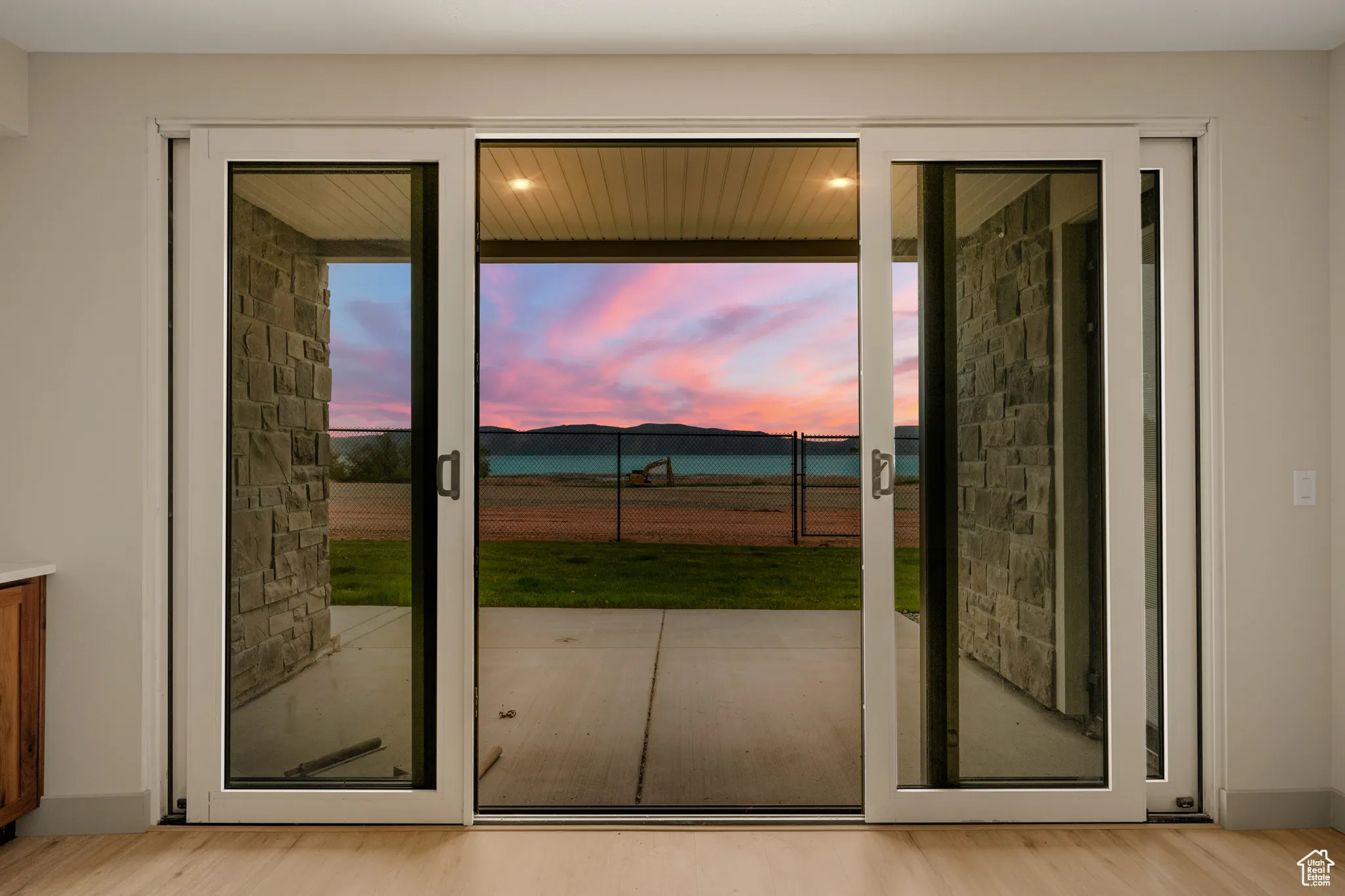 Entryway with light wood-style floors and healthy amount of natural light