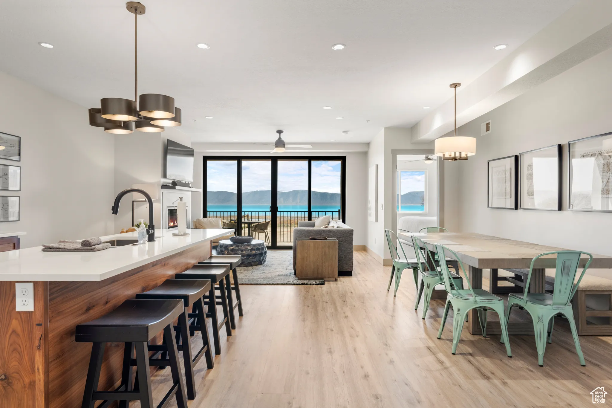 Dining room featuring light wood-type flooring, a chandelier, and recessed lighting