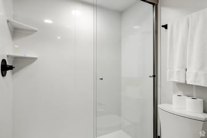 Bathroom with toilet and a shower stall