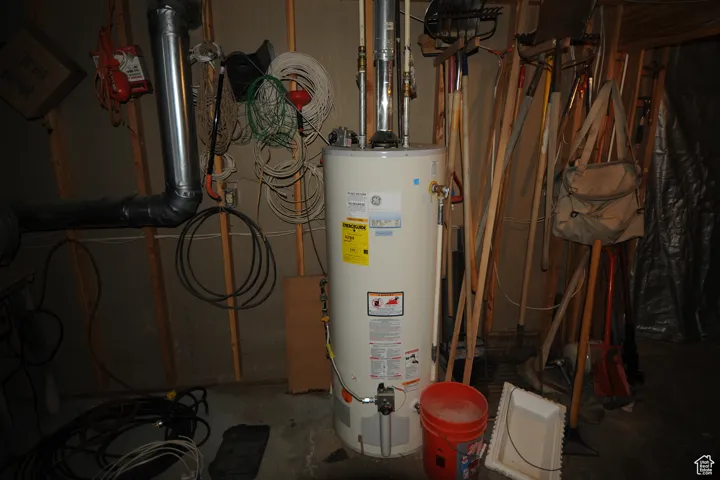 Utility room featuring gas water heater