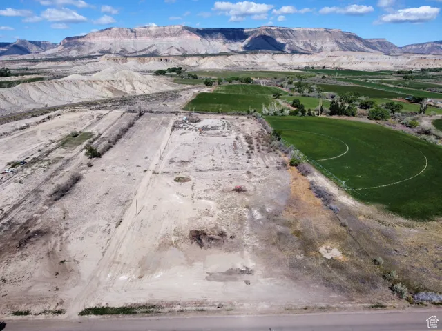 Aerial view of property and surrounding area with mountains and rural landscape