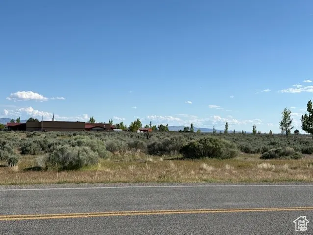 View of asphalt street featuring a view of countryside