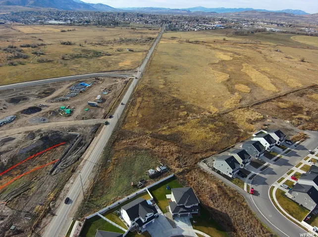Aerial view of property's location with a mountain backdrop