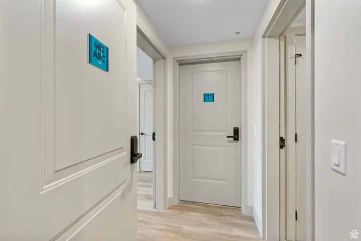 Hallway with light wood-type flooring