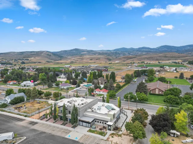 Aerial view of residential area featuring mountains