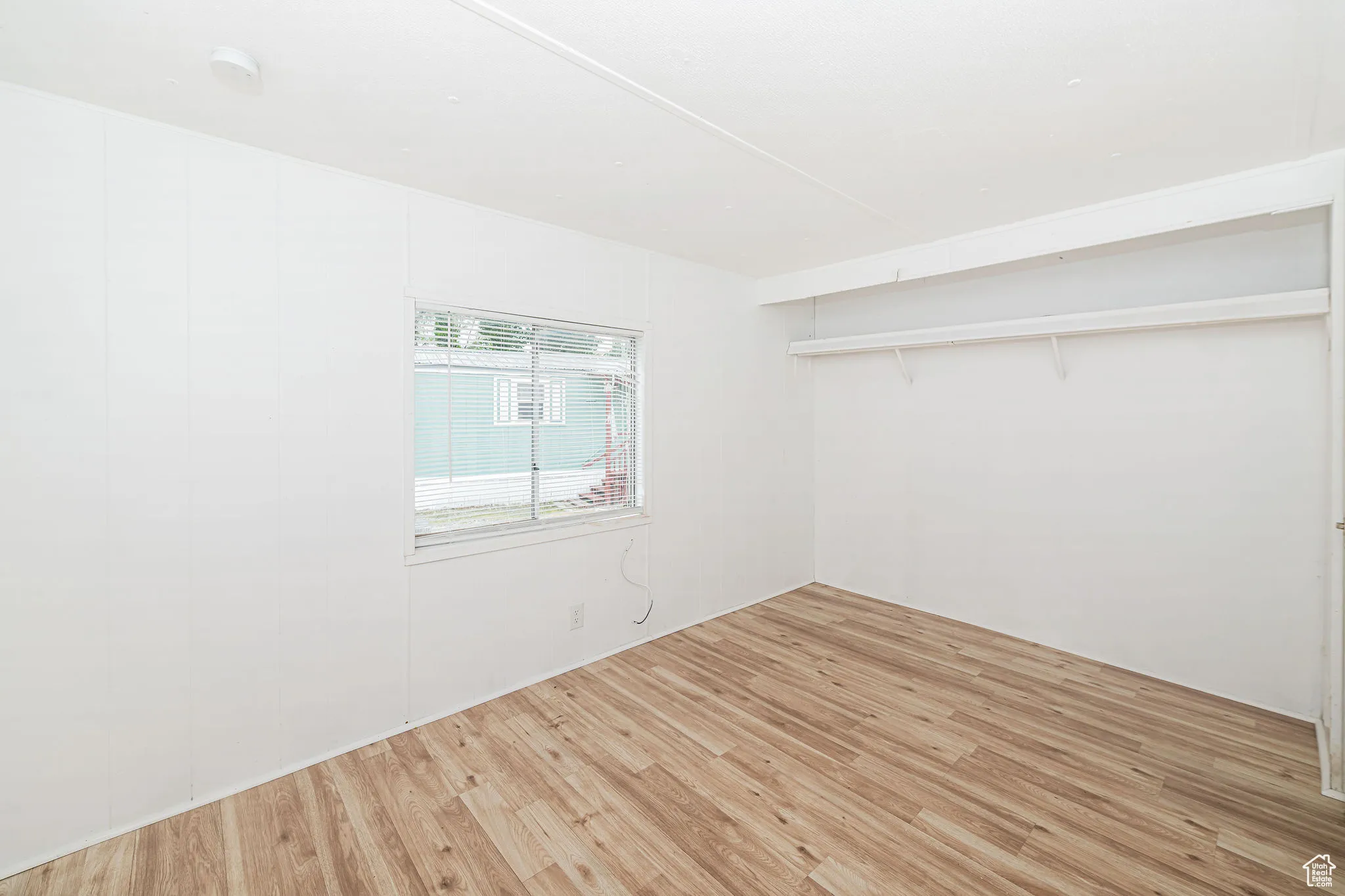 Empty room featuring light wood-style floors